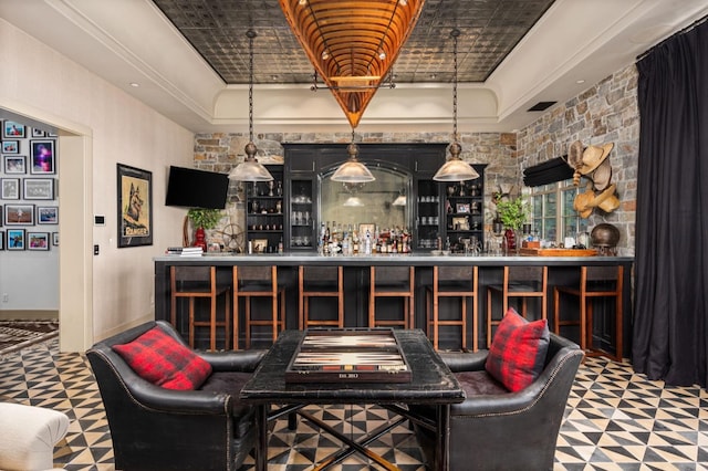 bar featuring a tray ceiling