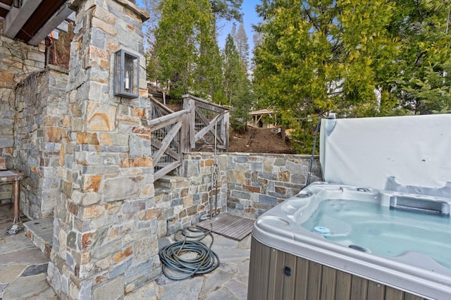 view of patio / terrace with a hot tub