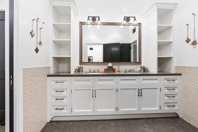 bathroom featuring tile walls and vanity