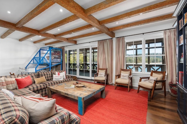 living room with dark hardwood / wood-style floors and beam ceiling