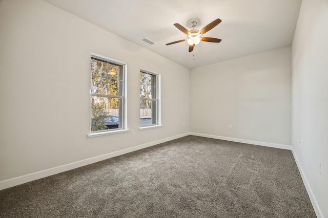 empty room with carpet floors and ceiling fan