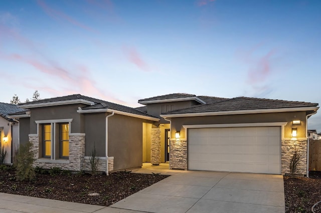 prairie-style house featuring a garage