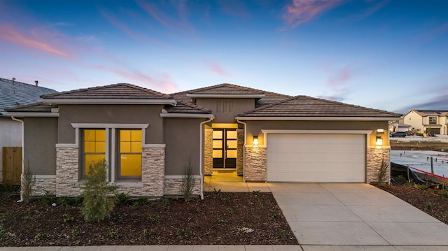 prairie-style house featuring a garage