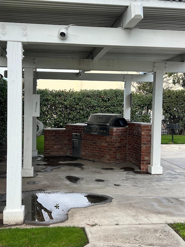 view of patio featuring a grill and exterior kitchen