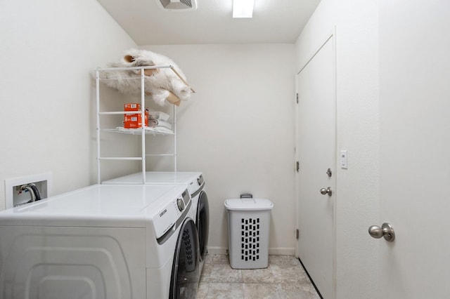 laundry area featuring washing machine and dryer