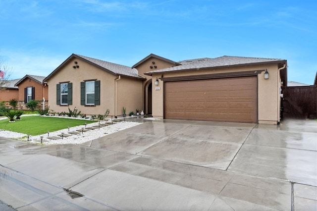 ranch-style home featuring a garage and a front yard