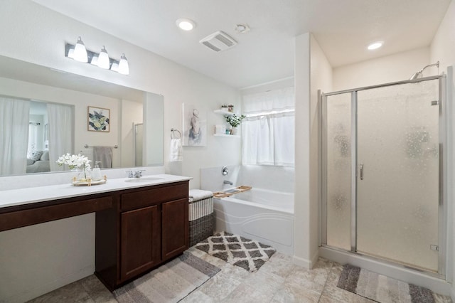 bathroom featuring vanity and plus walk in shower