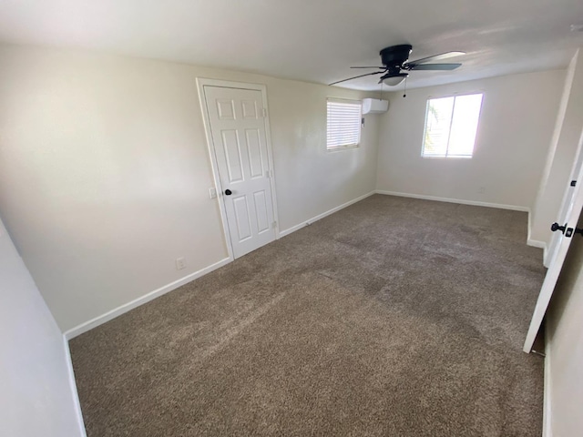 13208 S Marsh Ave, Caruthers, CA 93609 - unfurnished bedroom featuring carpet flooring, a wall mounted AC, and a ceiling fan