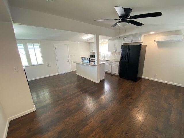 13208 S Marsh Ave, Caruthers, CA 93609 - kitchen featuring black fridge, white cabinets, dark wood-style flooring, a ceiling fan, and light countertops