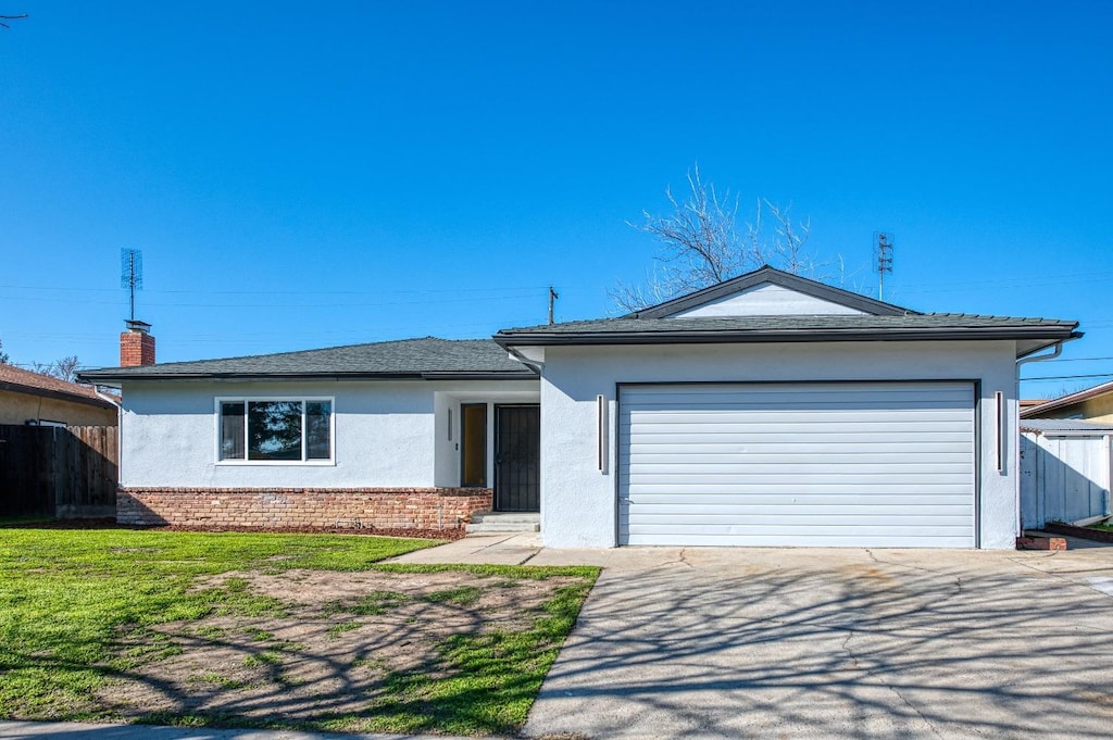 ranch-style home featuring a garage