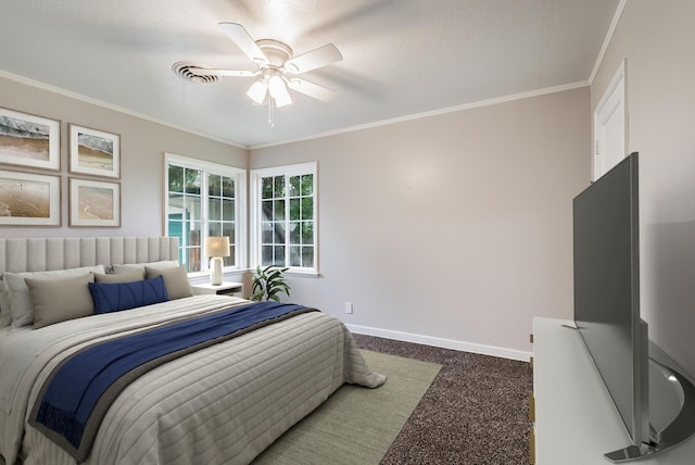 carpeted bedroom with ornamental molding, baseboards, and a ceiling fan