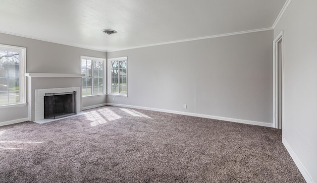 unfurnished living room featuring crown molding, carpet, and plenty of natural light