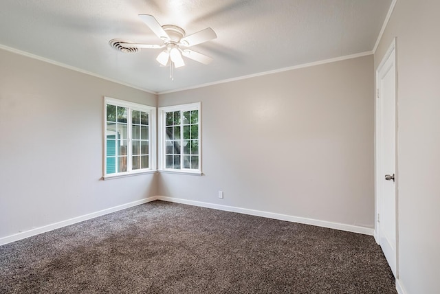 unfurnished room featuring ornamental molding, dark colored carpet, a ceiling fan, and baseboards