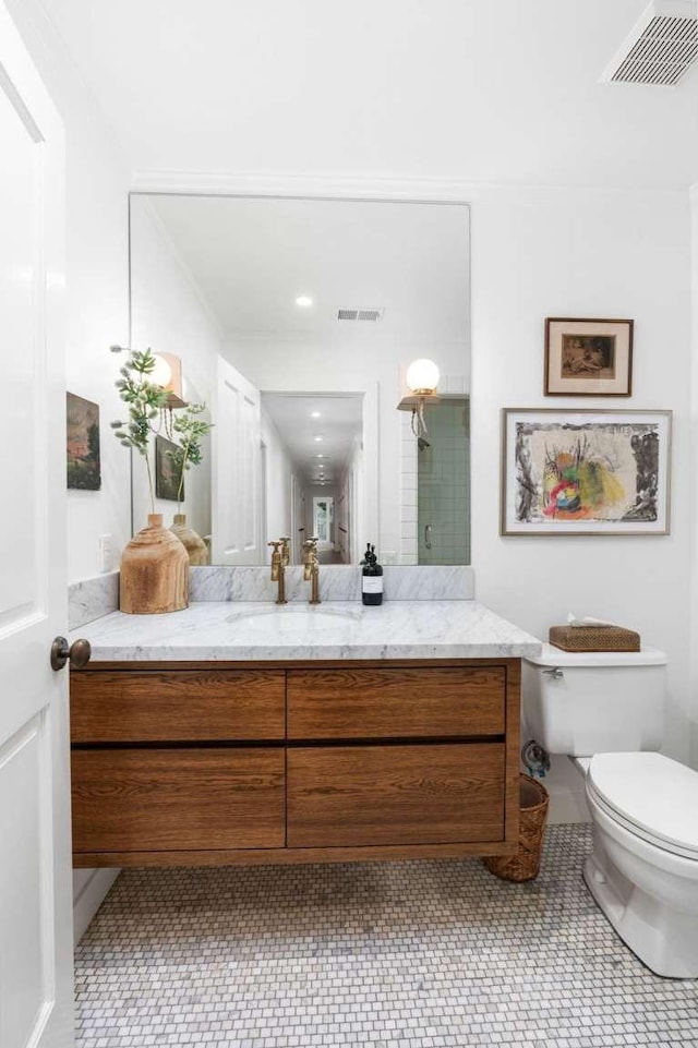 bathroom with vanity and toilet