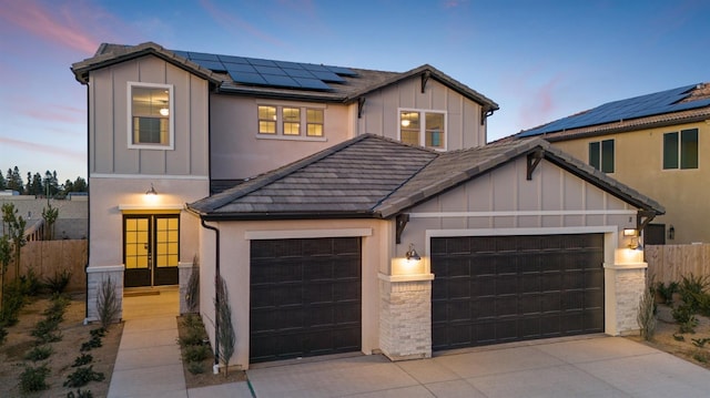 view of front facade featuring solar panels