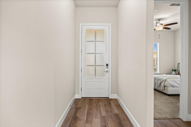 doorway to outside with ceiling fan and light hardwood / wood-style flooring