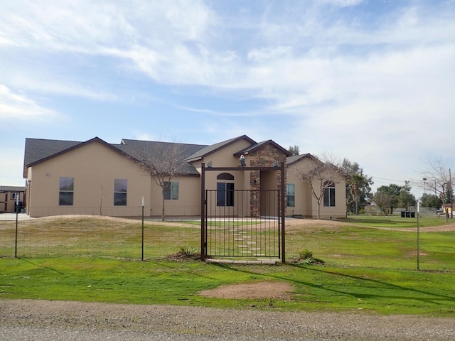 single story home with a front yard