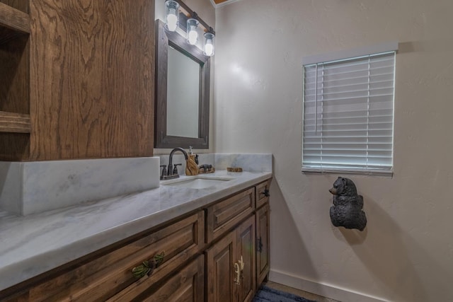 bathroom with vanity and baseboards