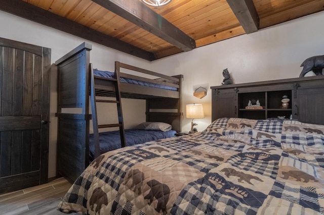 bedroom featuring wooden ceiling, beam ceiling, and wood tiled floor