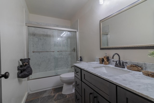 full bathroom with toilet, shower / bath combination with glass door, and vanity