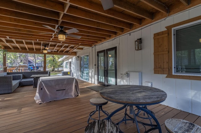 wooden terrace with a ceiling fan