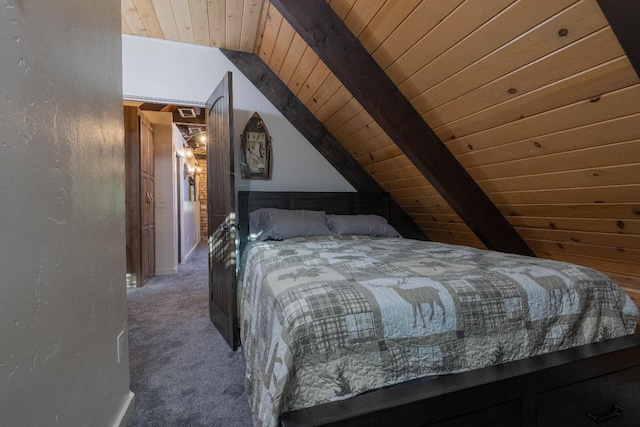 bedroom with lofted ceiling with beams, wooden ceiling, and dark carpet