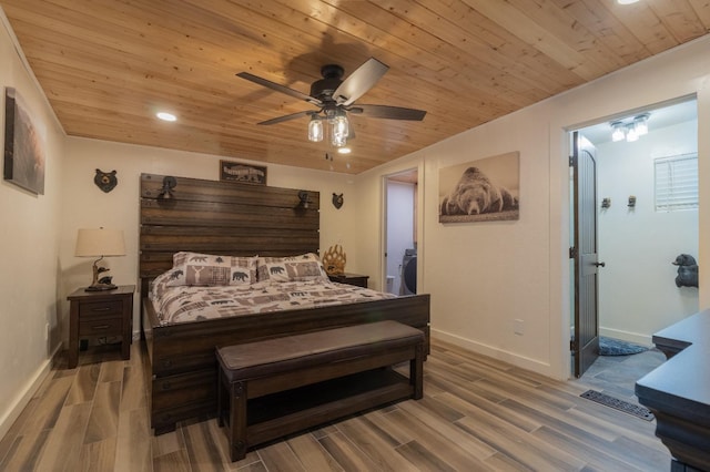 bedroom with wood finished floors, wood ceiling, and baseboards