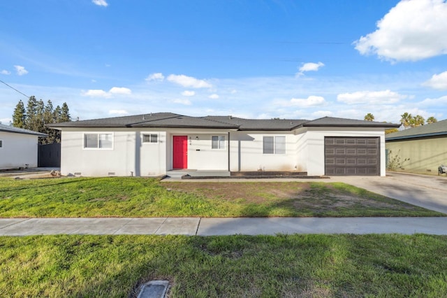 view of front of property featuring a garage and a front lawn