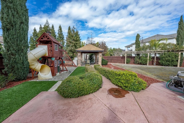 view of yard featuring a gazebo and a playground