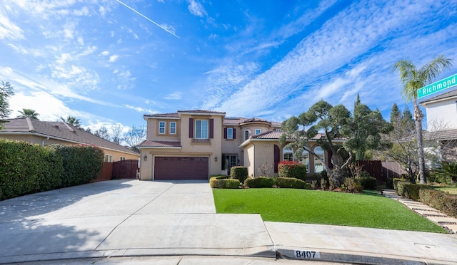 view of front of house with a garage and a front yard