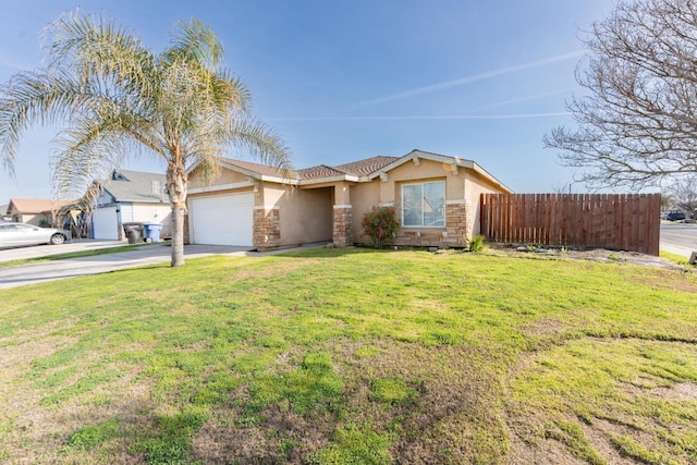 single story home featuring a garage and a front lawn