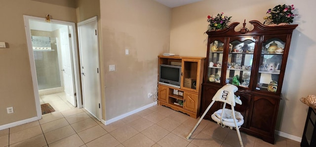 living area with light tile patterned floors