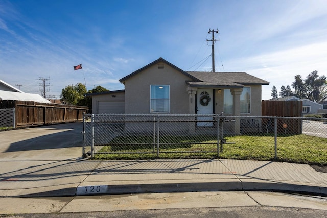 view of front of house with a garage and a front lawn