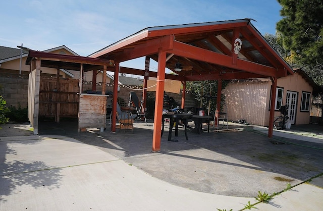 view of patio / terrace featuring a gazebo and ceiling fan