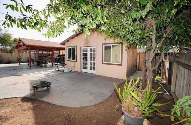 view of patio featuring french doors and an outdoor fire pit