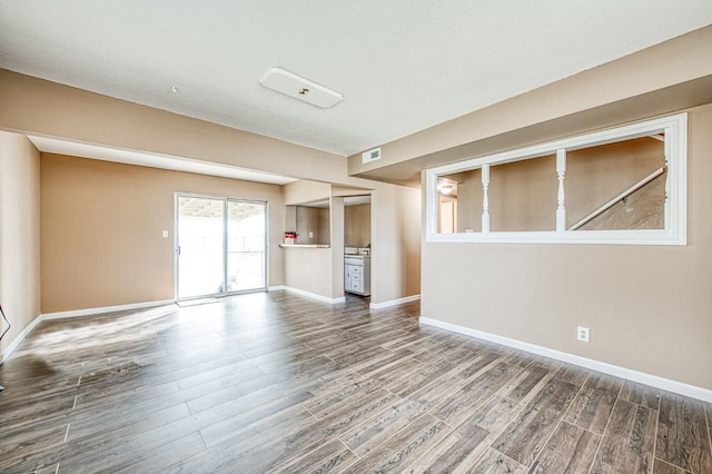 unfurnished living room featuring wood-type flooring