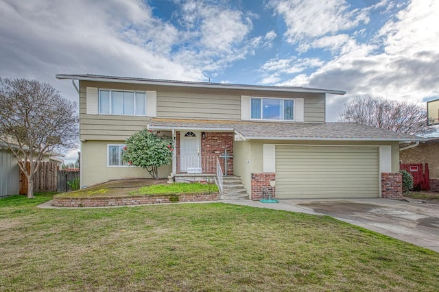 view of front of home with a garage and a front lawn