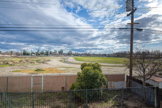 view of yard with a rural view