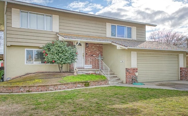 front facade featuring a garage and a front lawn