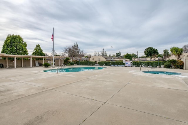 pool featuring a patio and fence