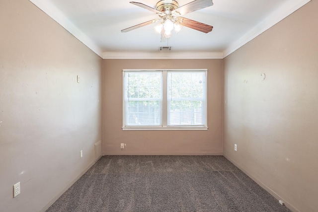 unfurnished room with visible vents, carpet, ceiling fan, and ornamental molding