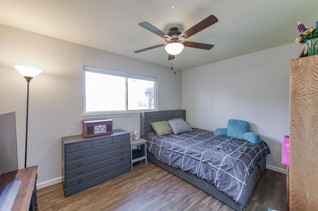 bedroom with hardwood / wood-style flooring and ceiling fan