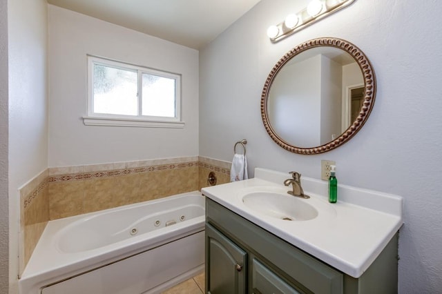 bathroom featuring vanity, tile patterned flooring, and a bathtub