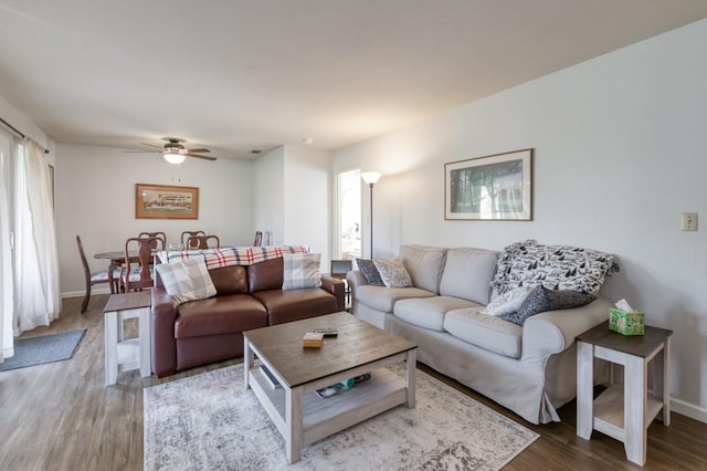 living room with hardwood / wood-style flooring and ceiling fan