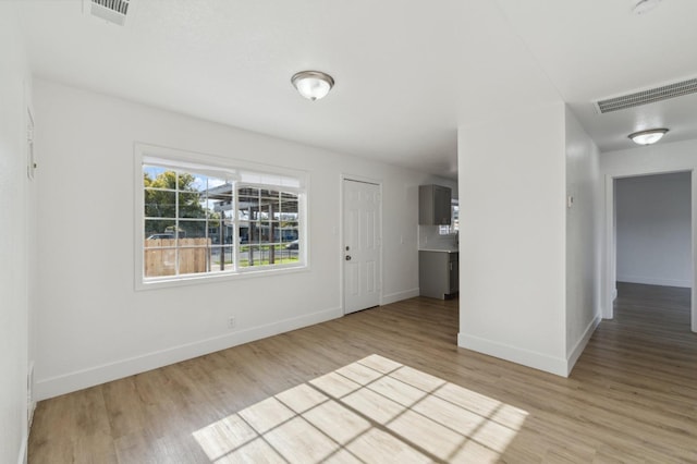 spare room featuring light wood-type flooring