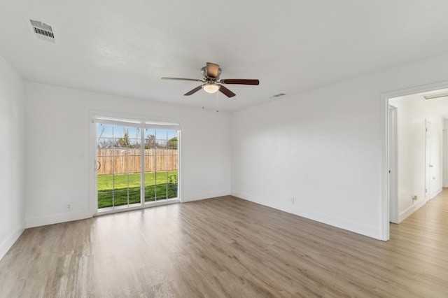 empty room featuring light hardwood / wood-style flooring and ceiling fan