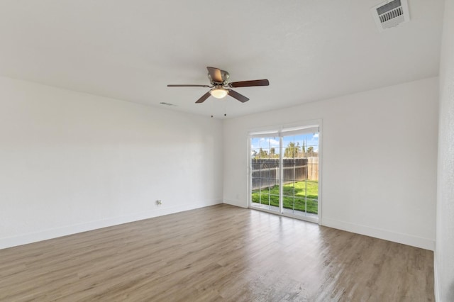 unfurnished room featuring light wood-type flooring and ceiling fan