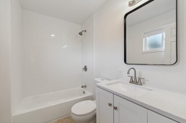 full bathroom featuring tiled shower / bath combo, vanity, and toilet