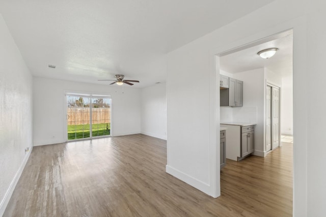 unfurnished room featuring ceiling fan and wood-type flooring