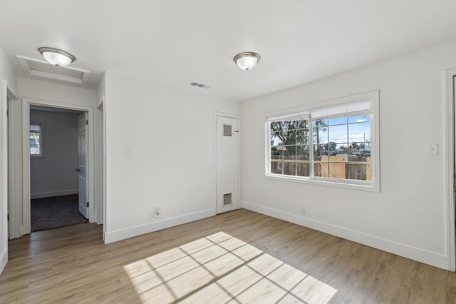 empty room featuring hardwood / wood-style flooring